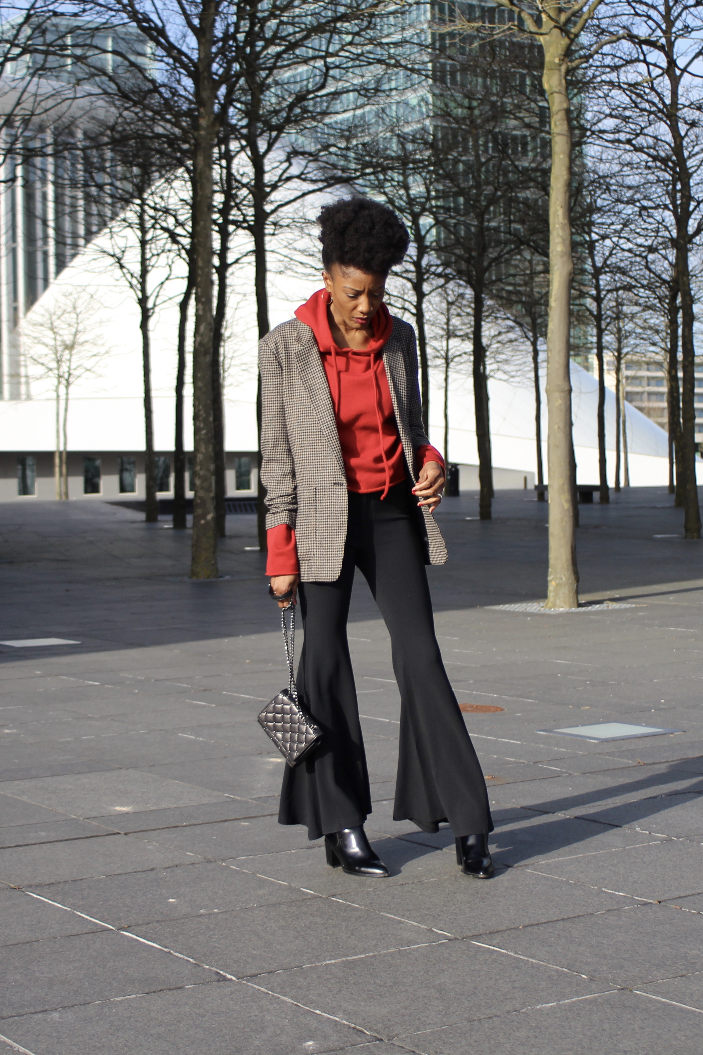 Flared pants style and red hoodie with a check roll-up-sleeves blazer