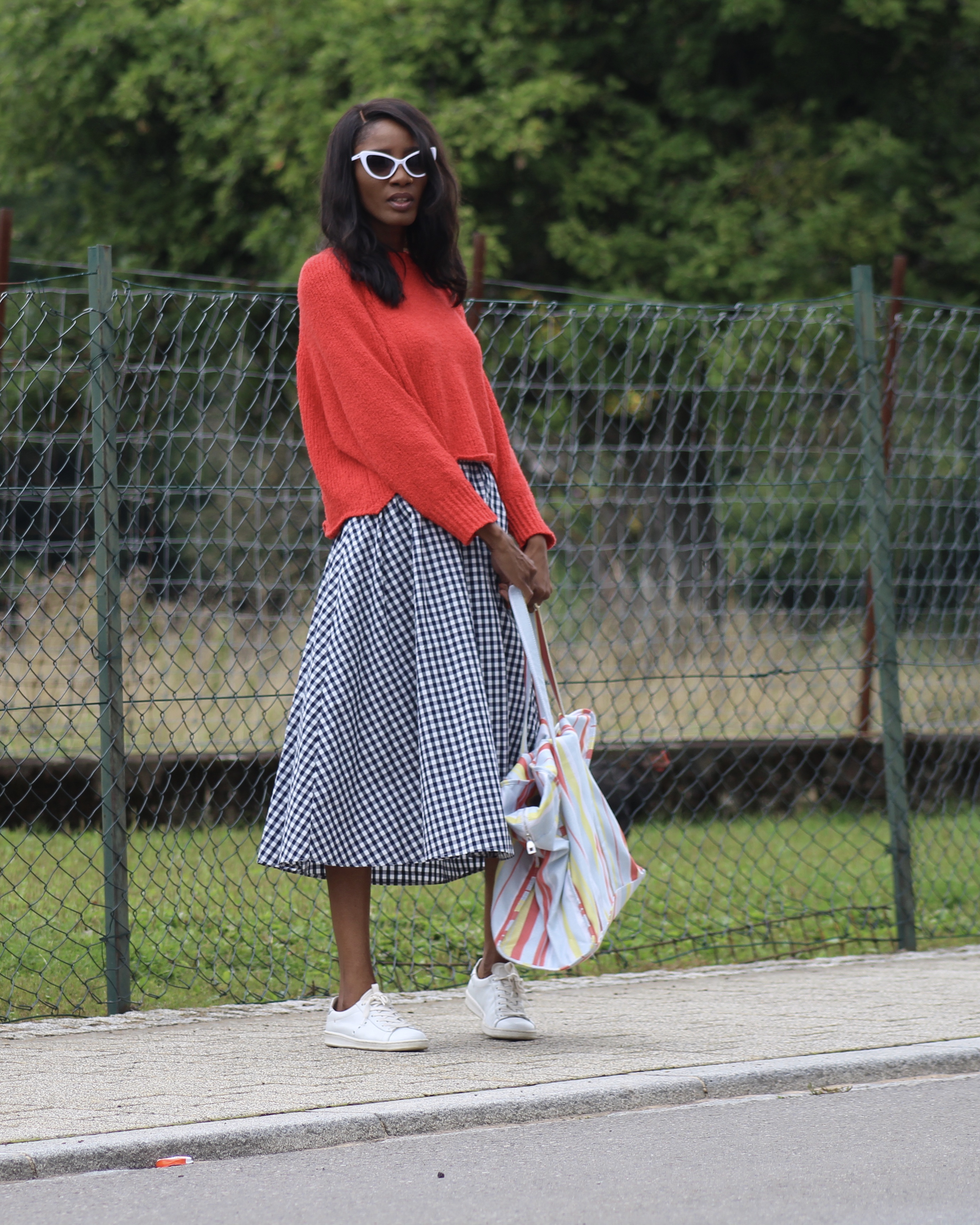 gingham skirt red sweater white sneakers tote bag